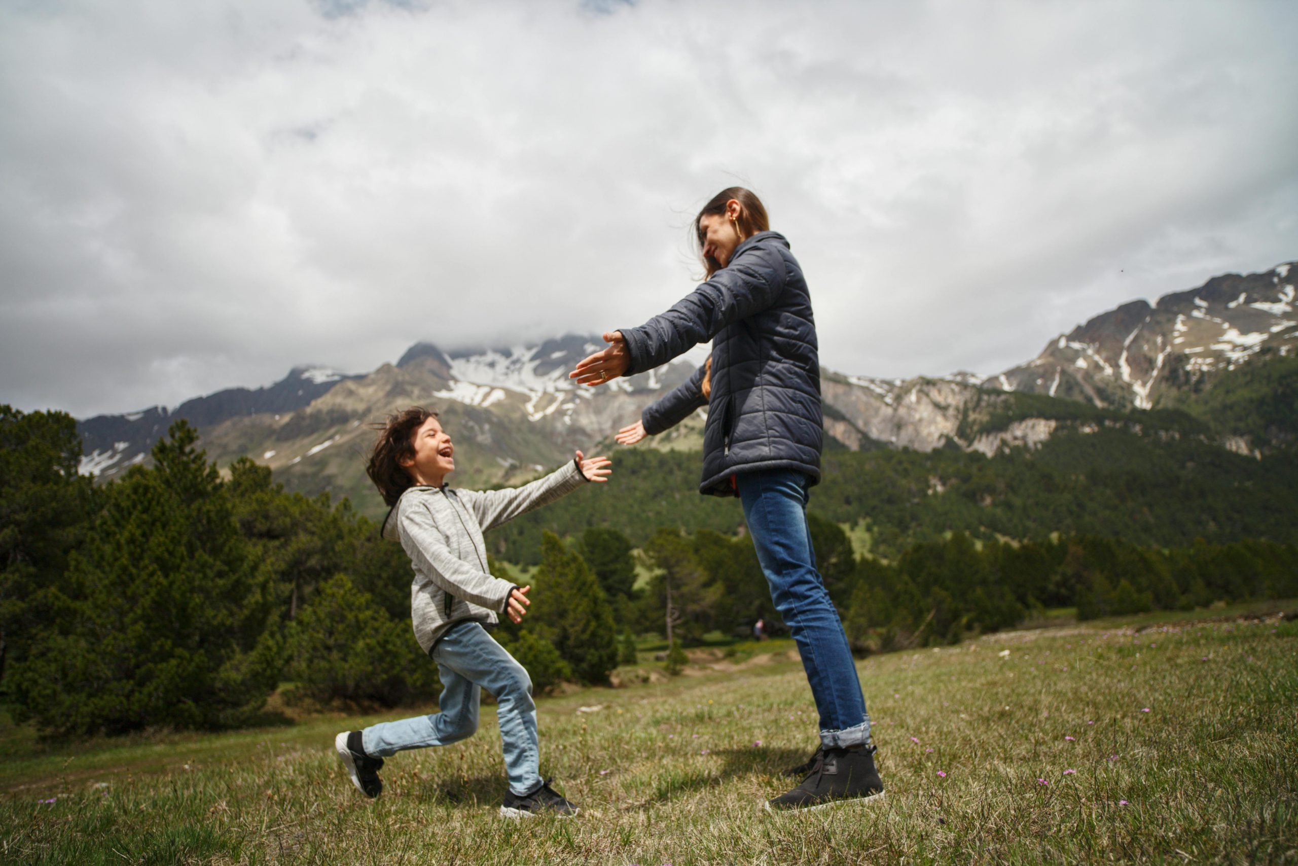 A child running towards their mother