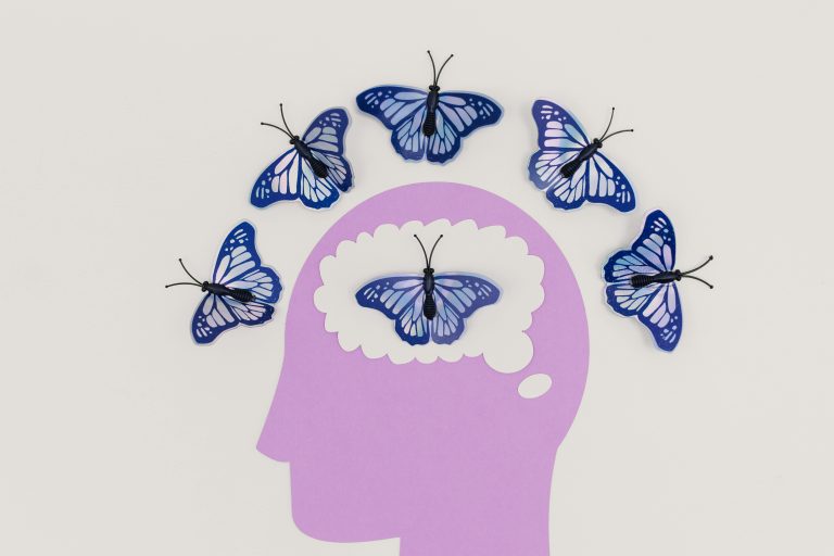 Image of a head surrounded by butterflies