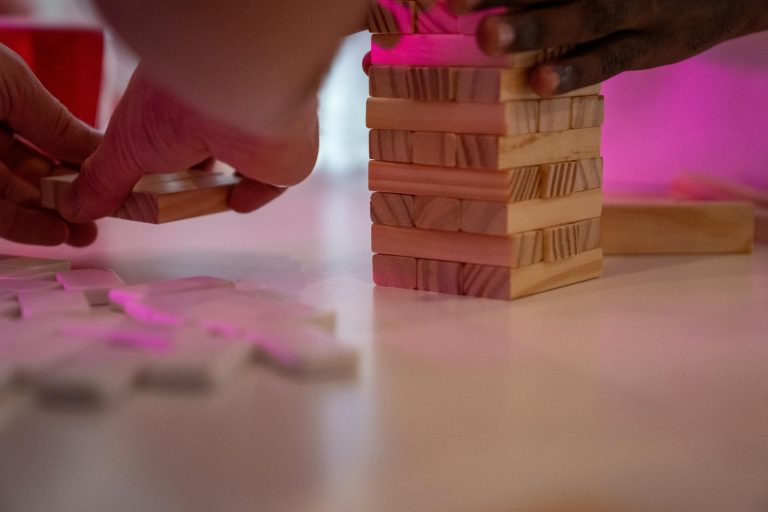 Close up of people playing Jenga