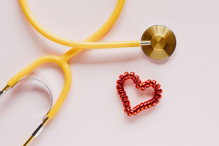Stethoscope near decorative coil heart