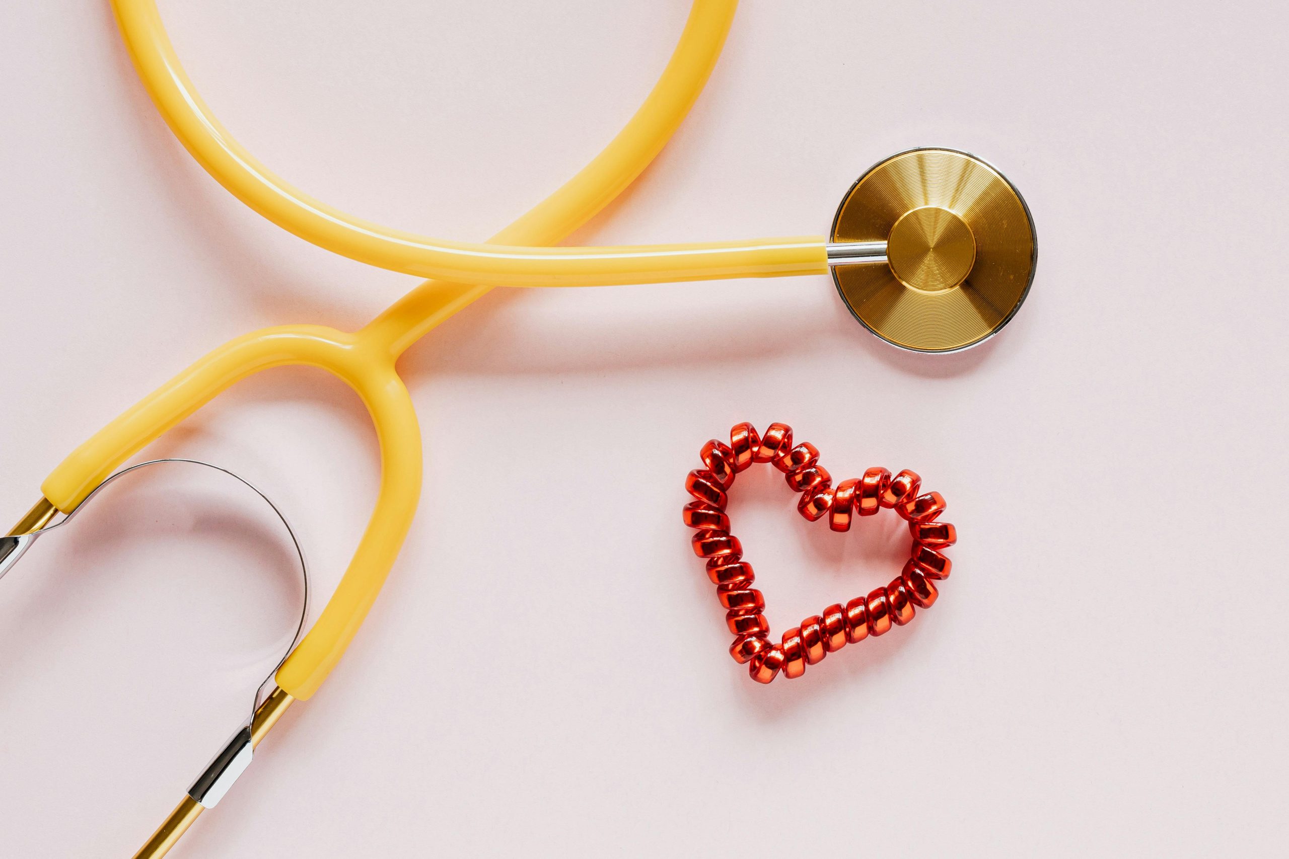 Stethoscope near decorative coil heart