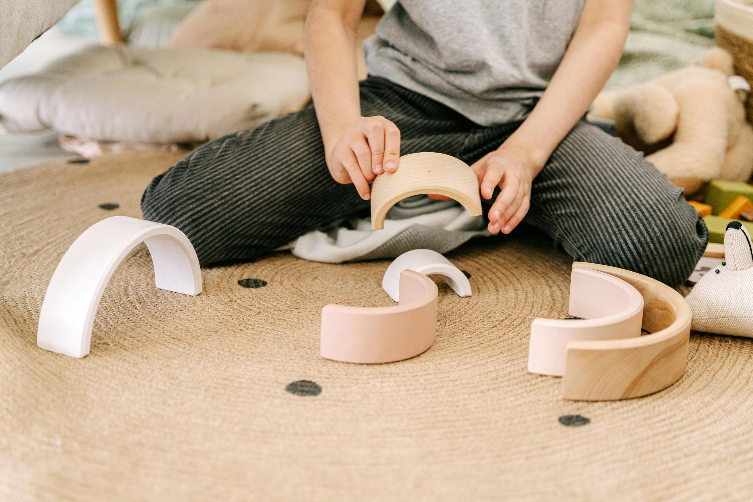 A child playing with wooden blocks