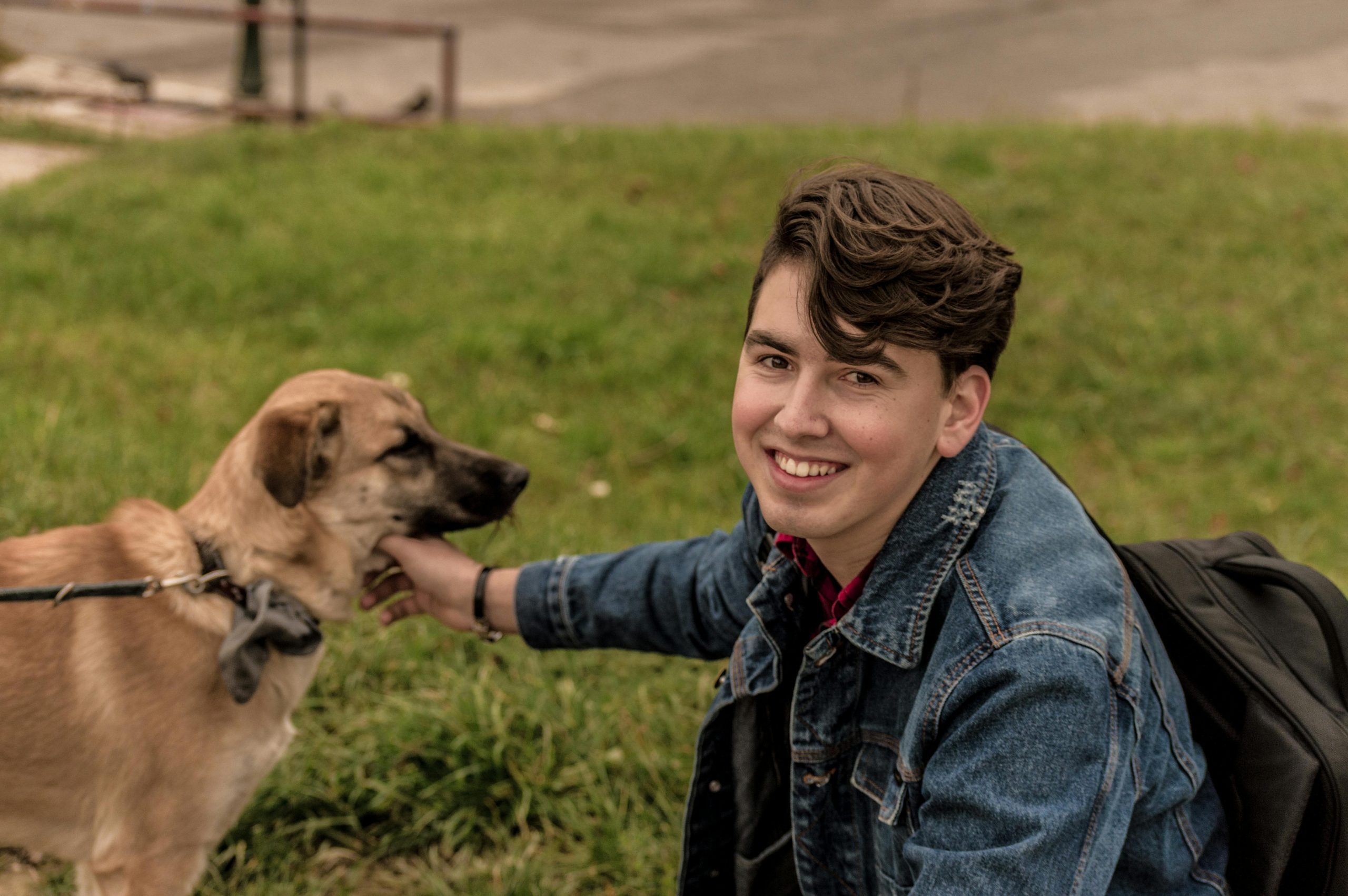 Smiling young man with his dog