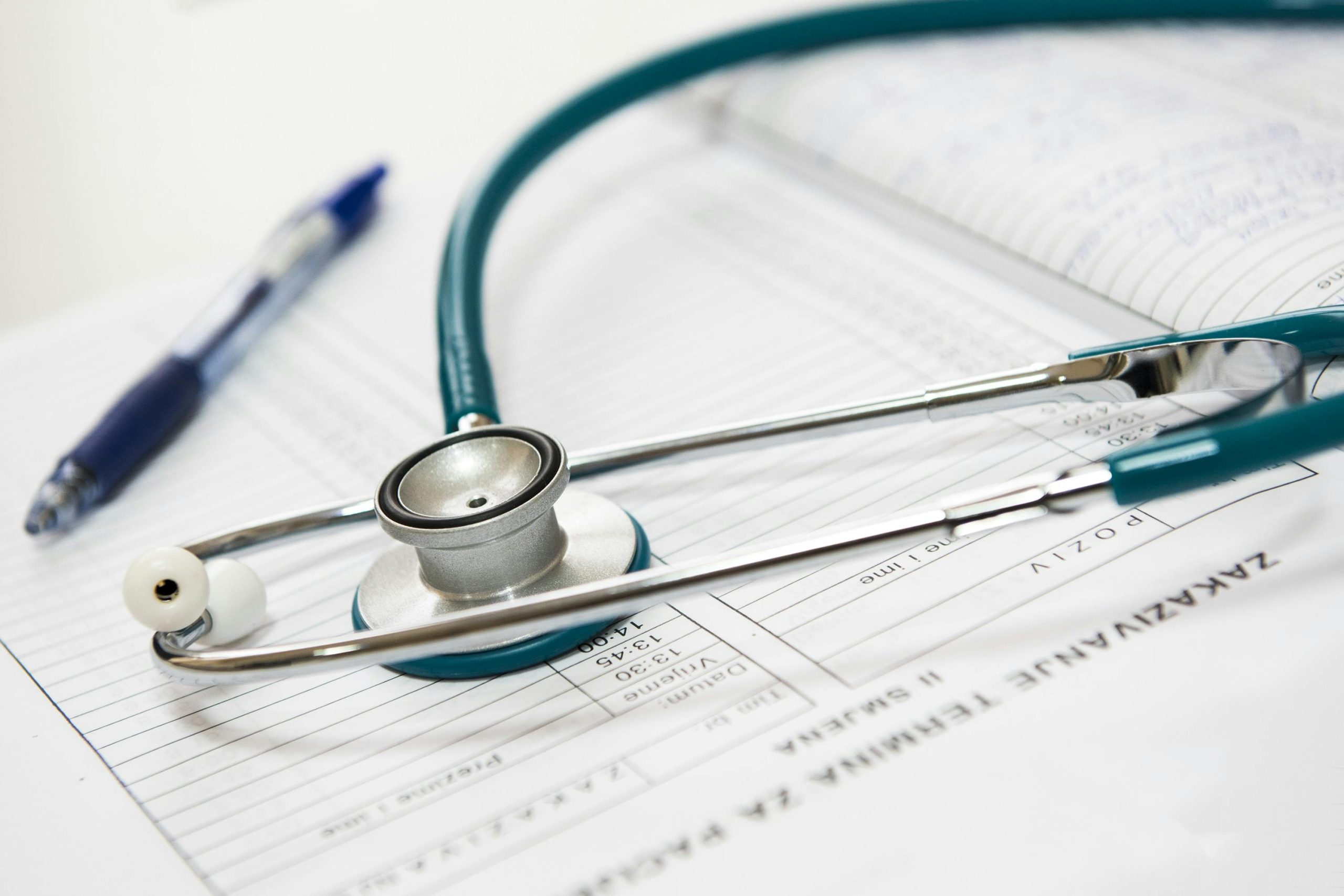Stethoscope resting on medical notes