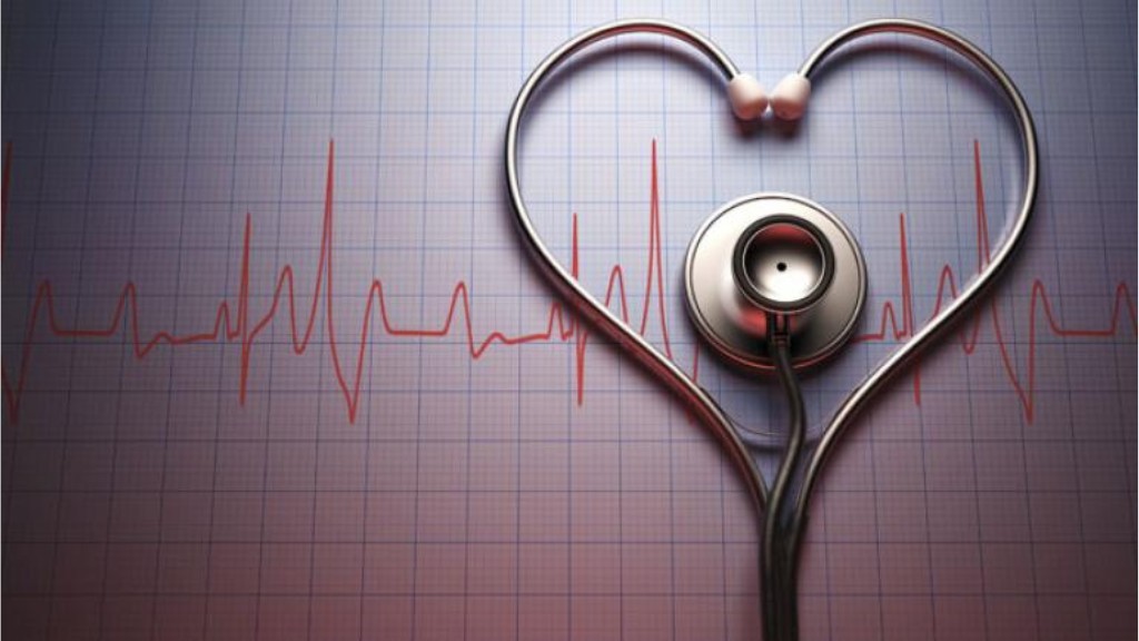 A stethoscope arranged in the shape of a heart on top of a medical chart.