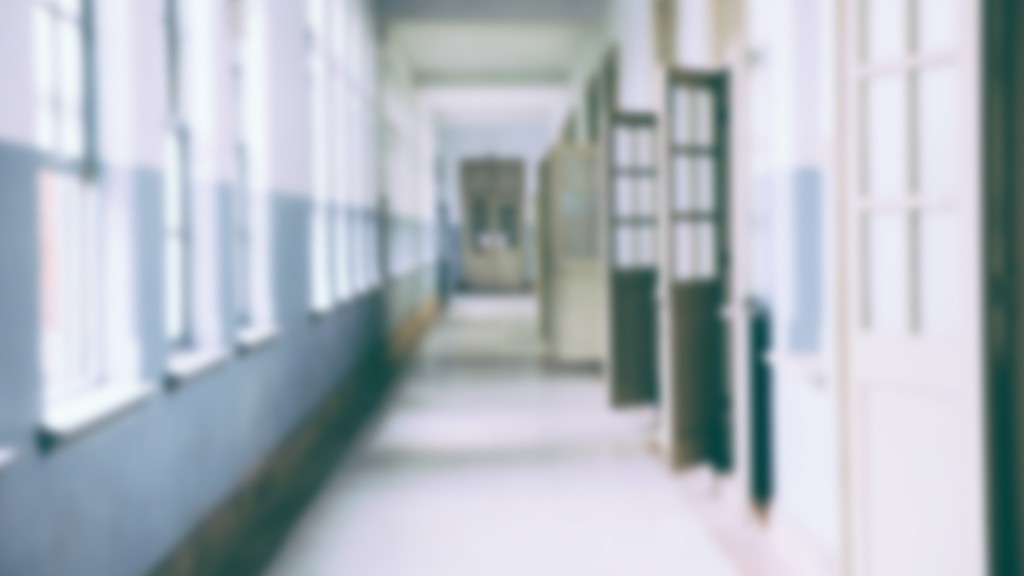 A blurred photo of an empty hallway.