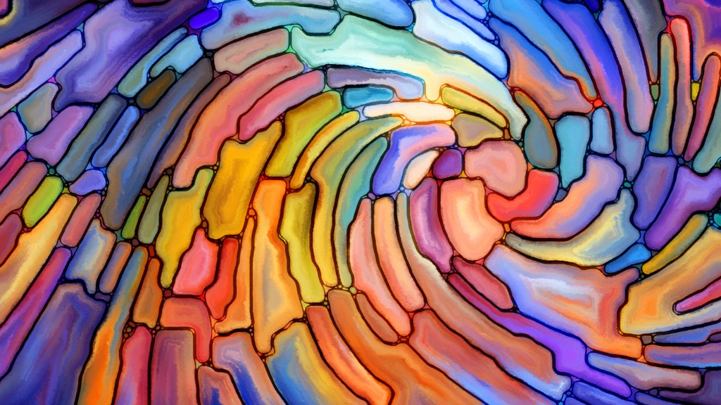 An abstract image of rainbow stained glass in a swirled pattern.