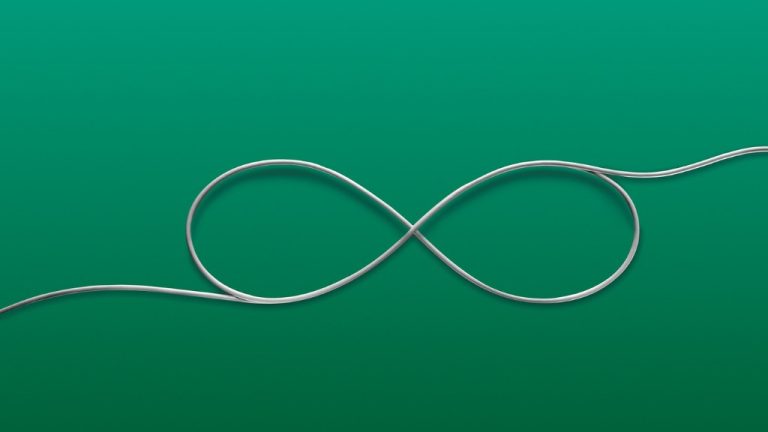An electrical cord overlapped in an infinity symbol on a green background.