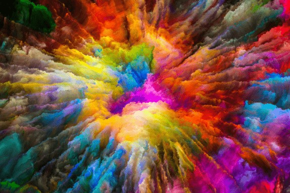 Coloured smoke powder exploding in a rainbow formation.