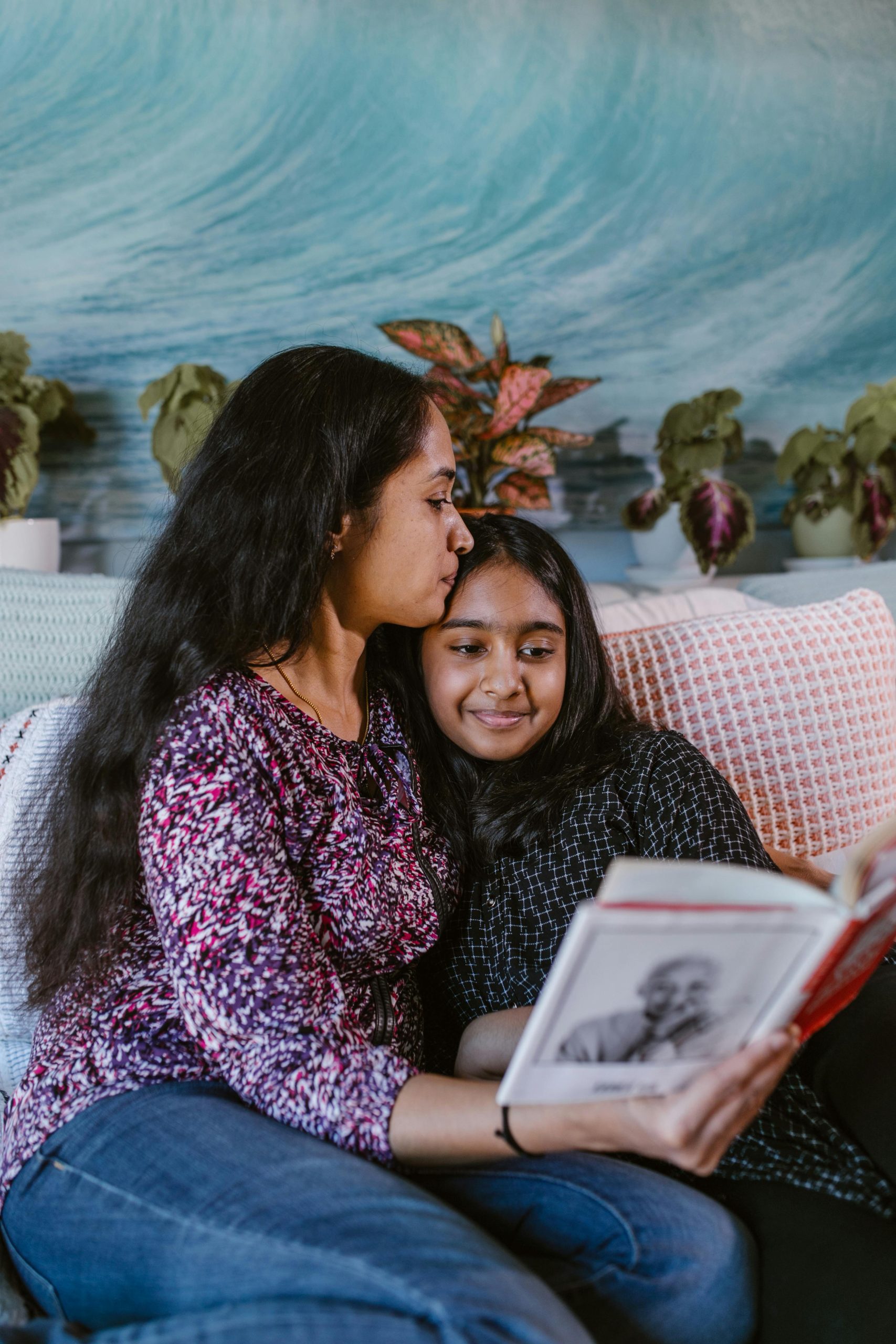A mother reading with her daughter