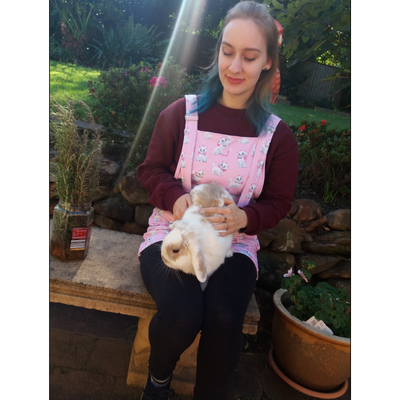 There's an image of the author sitting in the garden with her pet rabbit on her lap.