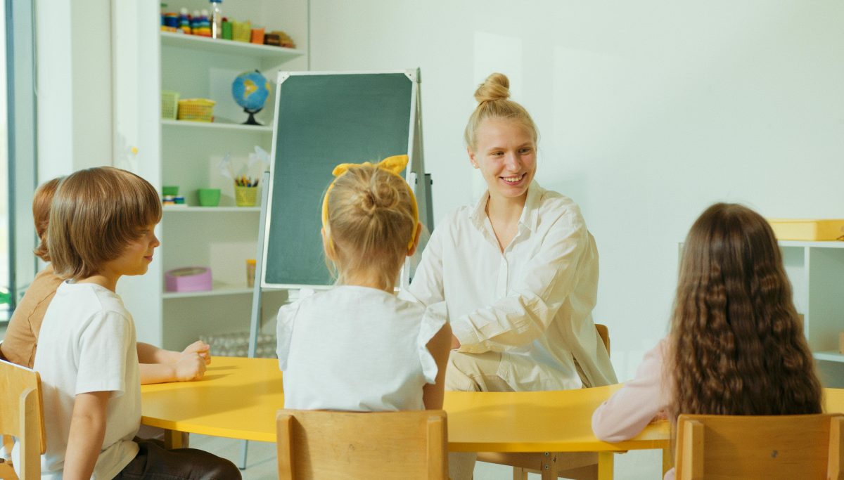 A teacher smiling at her students