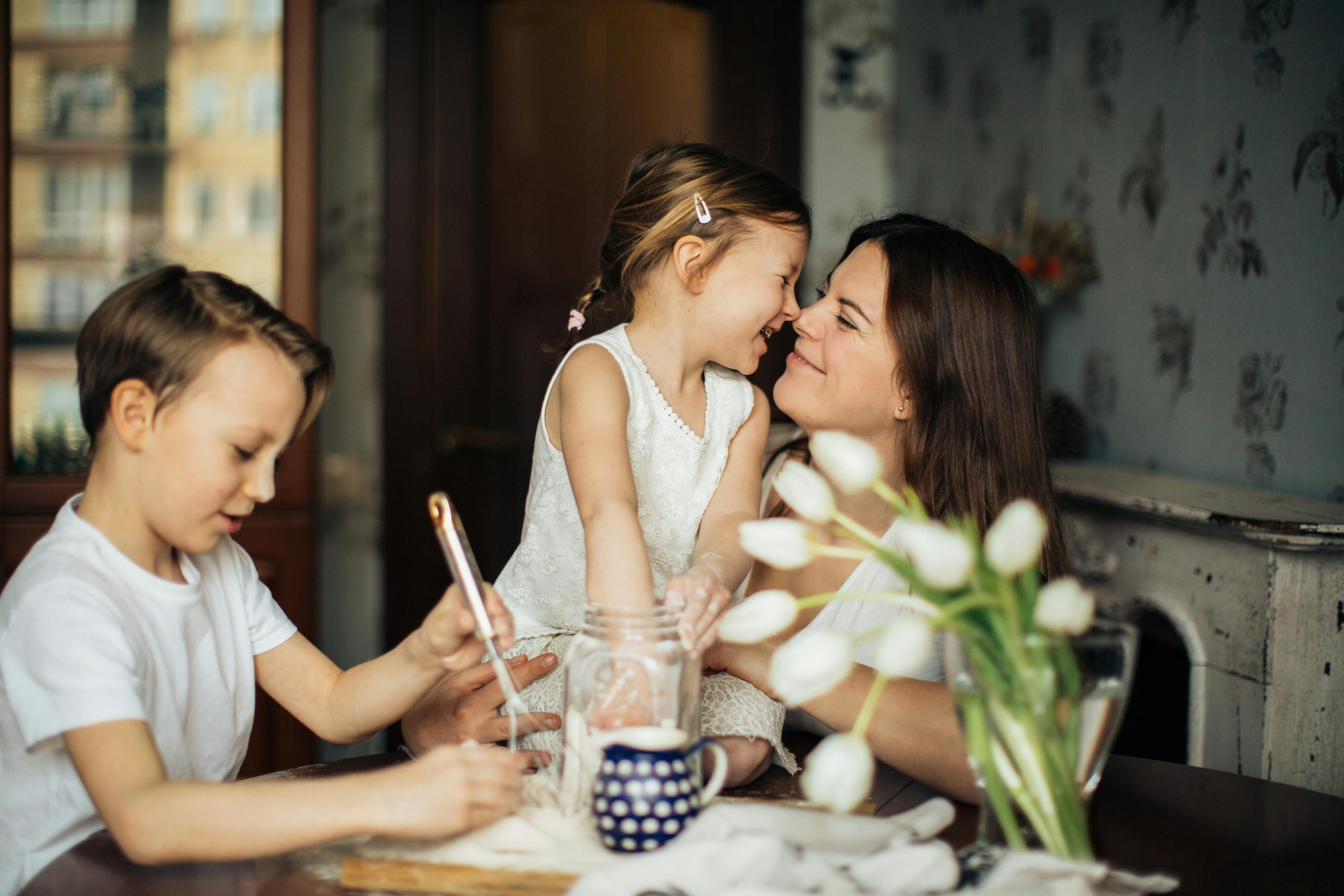 A mother plays with her children