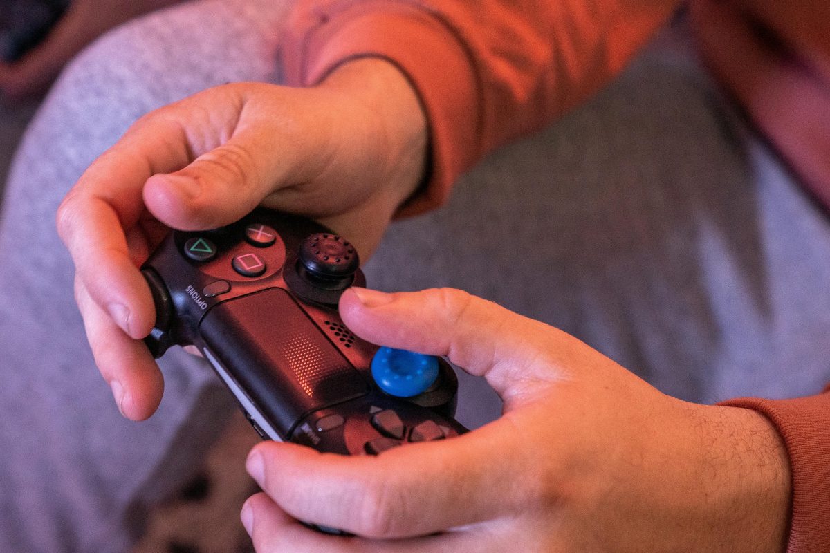 Person holding a game controller