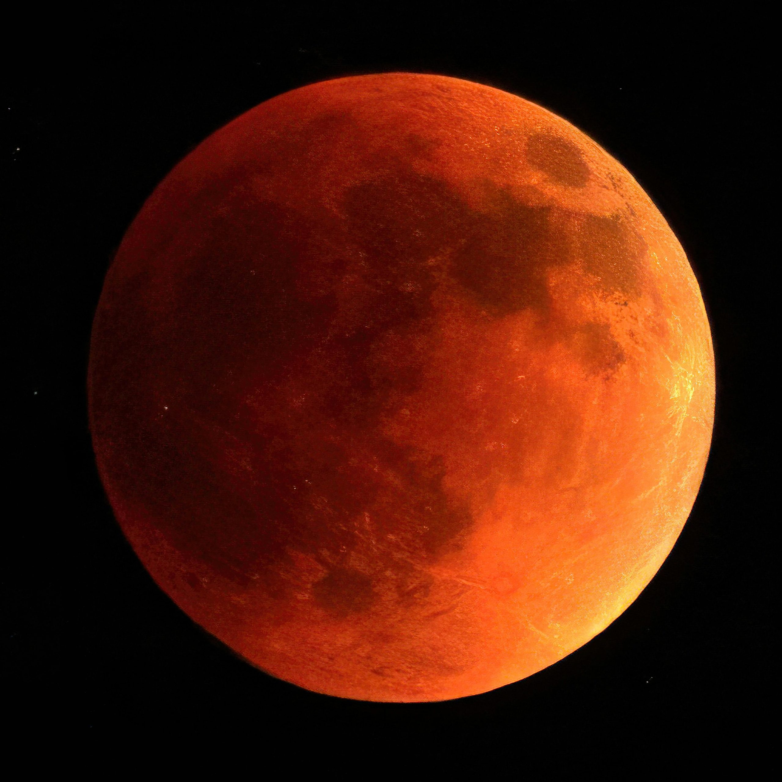Orange moon on black background