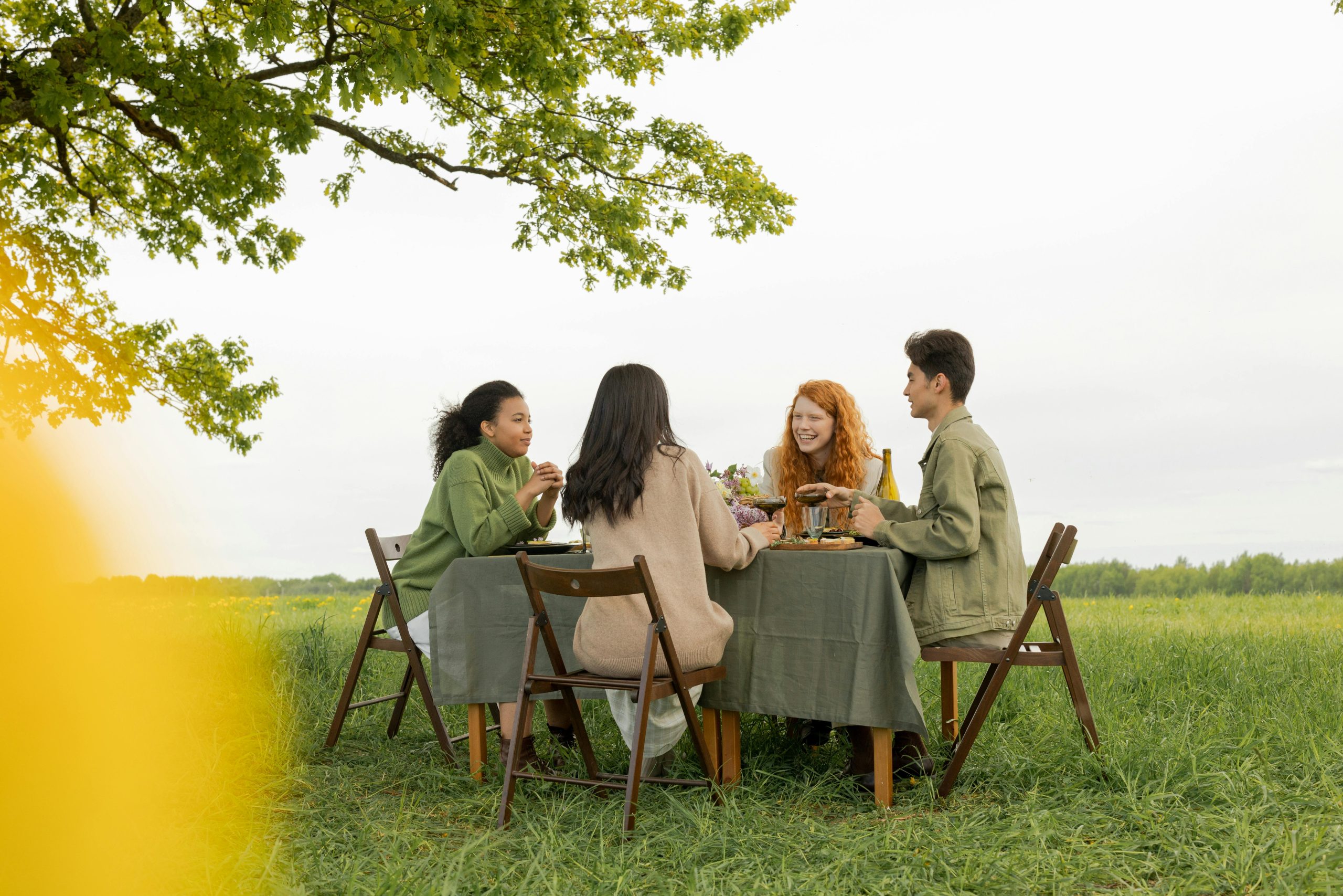 A group of friends share lunch outside