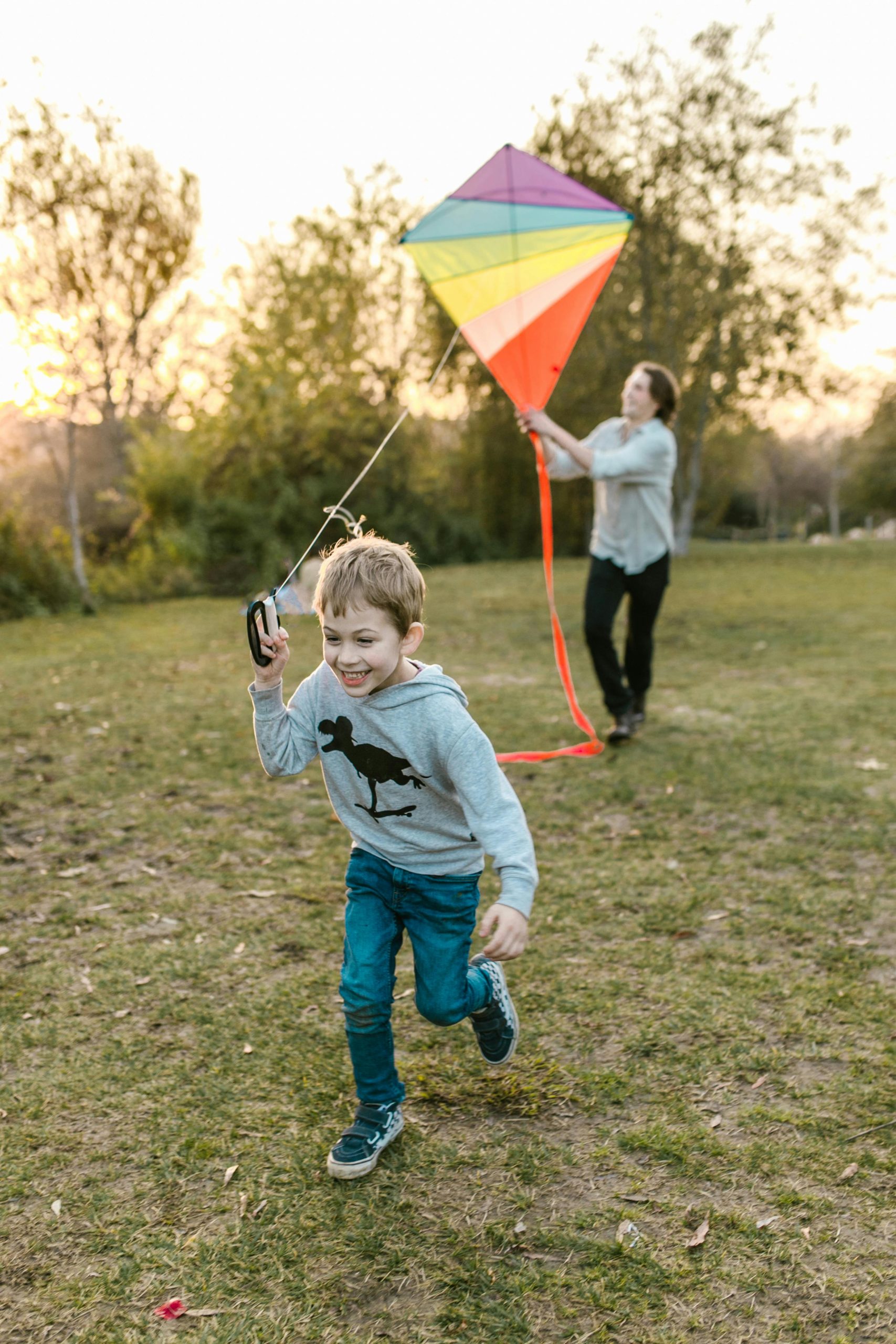 Father and son flying a kite