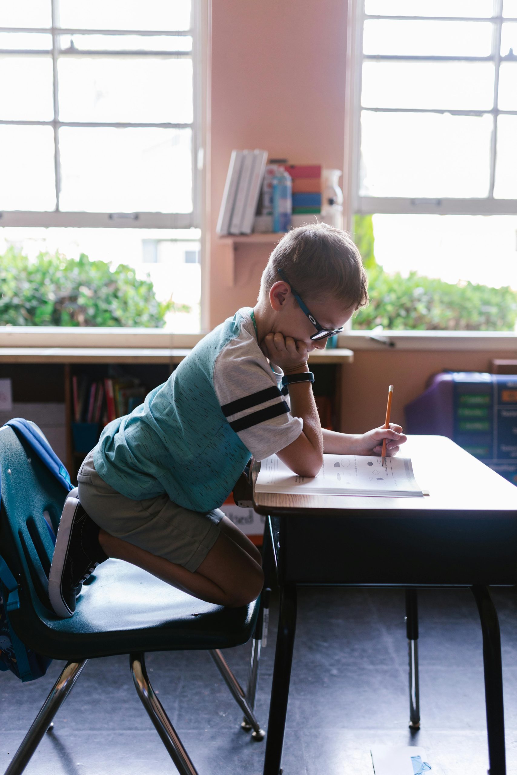 A little boy working at a desk
