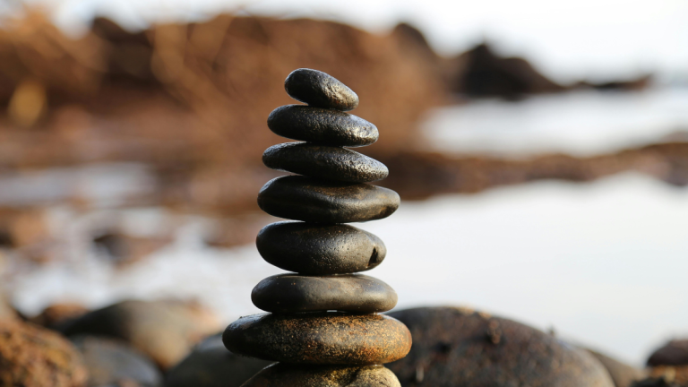 A delicately balanced pile of rocks in extreme focus.